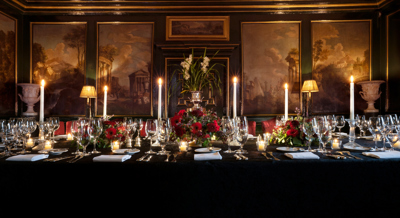 Table set with candles and paintings in the grand Italian private dining room at Prestonfield House Hotel Edinburgh 