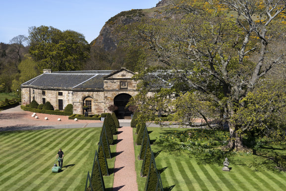 Gardener mowing the grounds of Prestonfield House, Edinburgh