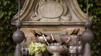 Champagne bottles and silver ice bucket outside on the Garden Room Terrace at Rhubarb restaurant in Edinburgh